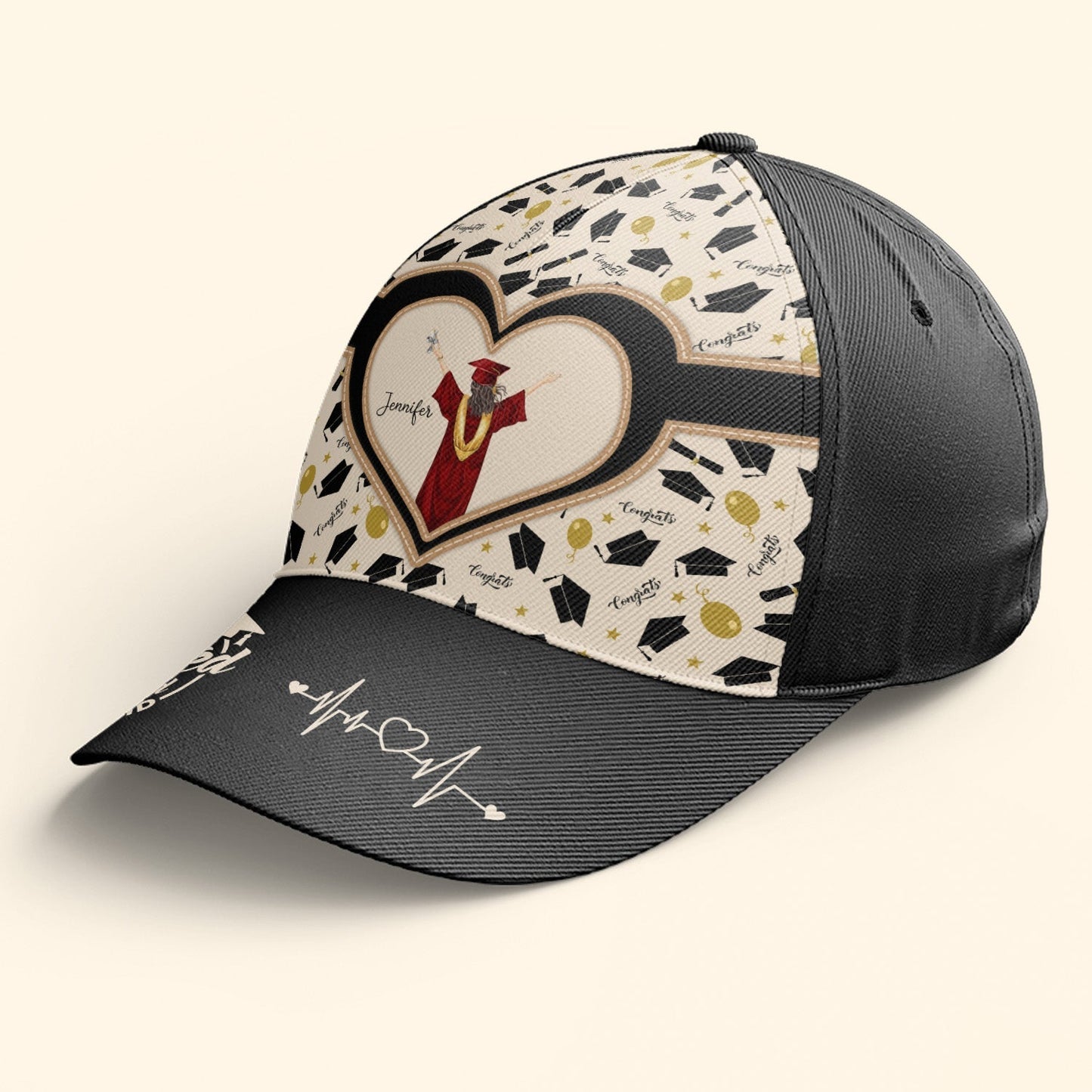 Personalized black graduation cap with 'She Believed She Could So She Did' quote, polyester material, heart shape design.