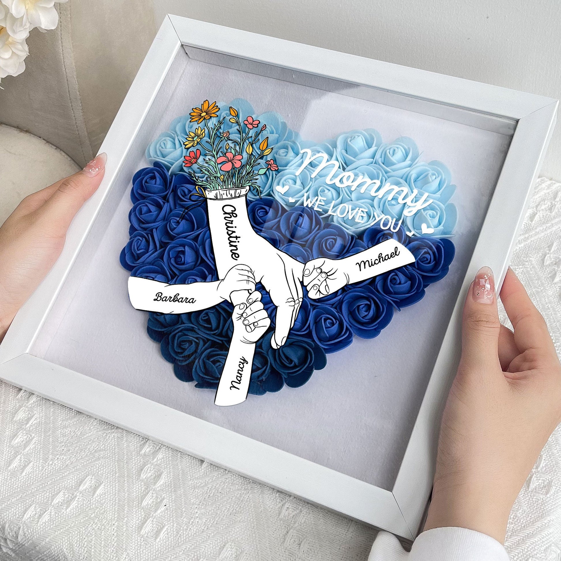 We Love You Mommy flower shadow box, heart-shaped design, white frame, blue flowers, Mother's Day gift.